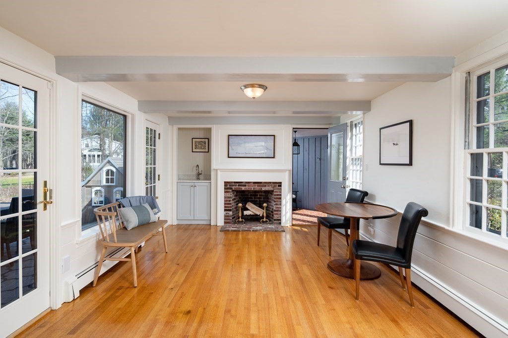 4 King Philip Path Hingham, MA 02043 - Photo 4 of 21 a living room with furniture and a fireplace