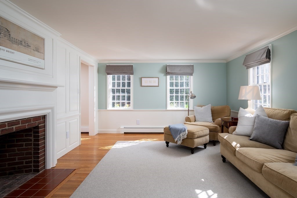 4 King Philip Path Hingham, MA 02043 - Photo 6 of 21 a living room with furniture and a fireplace