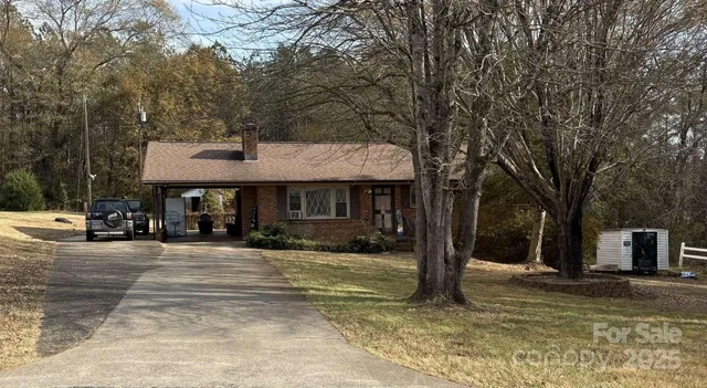 a front view of a building with trees