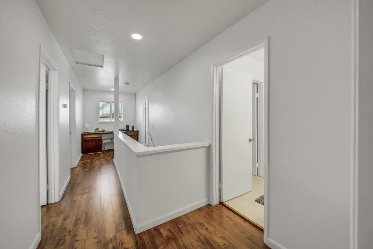 45640 Cimarron Road Indio, CA 92201 - Photo 12 of 25 a view of a hallway with wooden floor and furniture