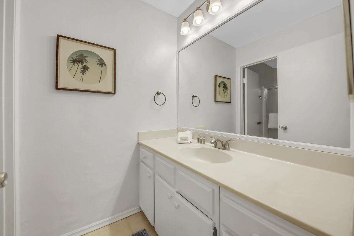 45640 Cimarron Road Indio, CA 92201 - Photo 16 of 25 a bathroom with a sink and a mirror