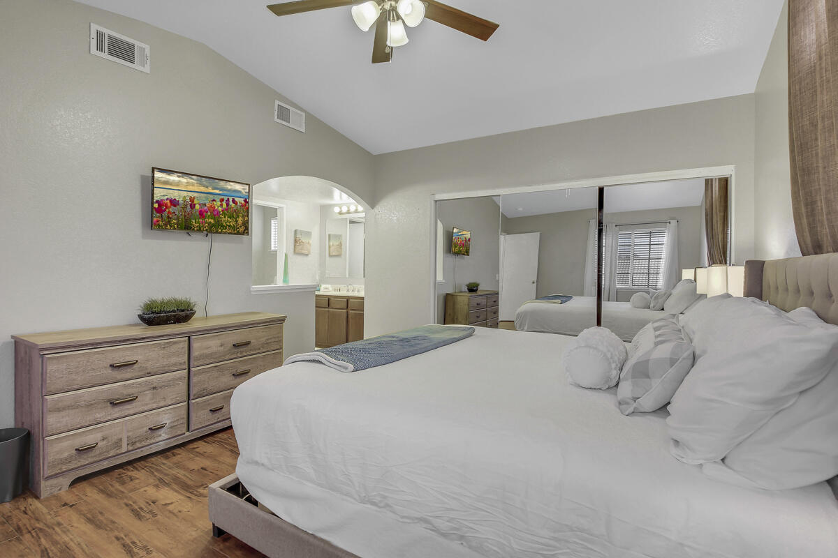 45640 Cimarron Road Indio, CA 92201 - Photo 18 of 25 a spacious bedroom with a bed and a dresser