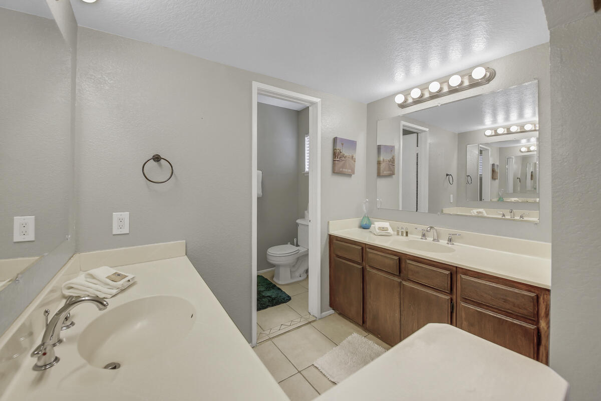 45640 Cimarron Road Indio, CA 92201 - Photo 19 of 25 a bathroom with a tub sink and mirror