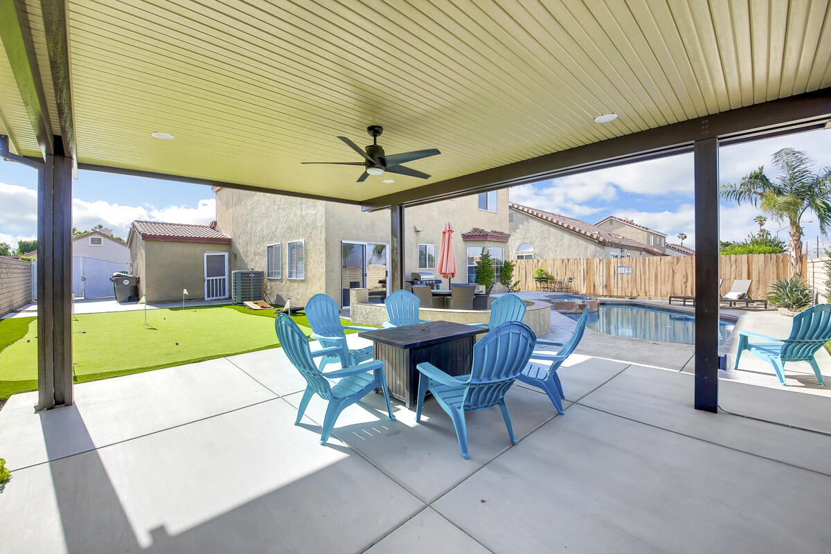 45640 Cimarron Road Indio, CA 92201 - Photo 23 of 25 a view of a patio with a table chairs and a backyard