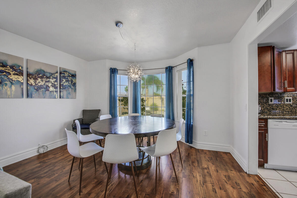 45640 Cimarron Road Indio, CA 92201 - Photo 5 of 25 a view of a dining room with furniture and wooden floor