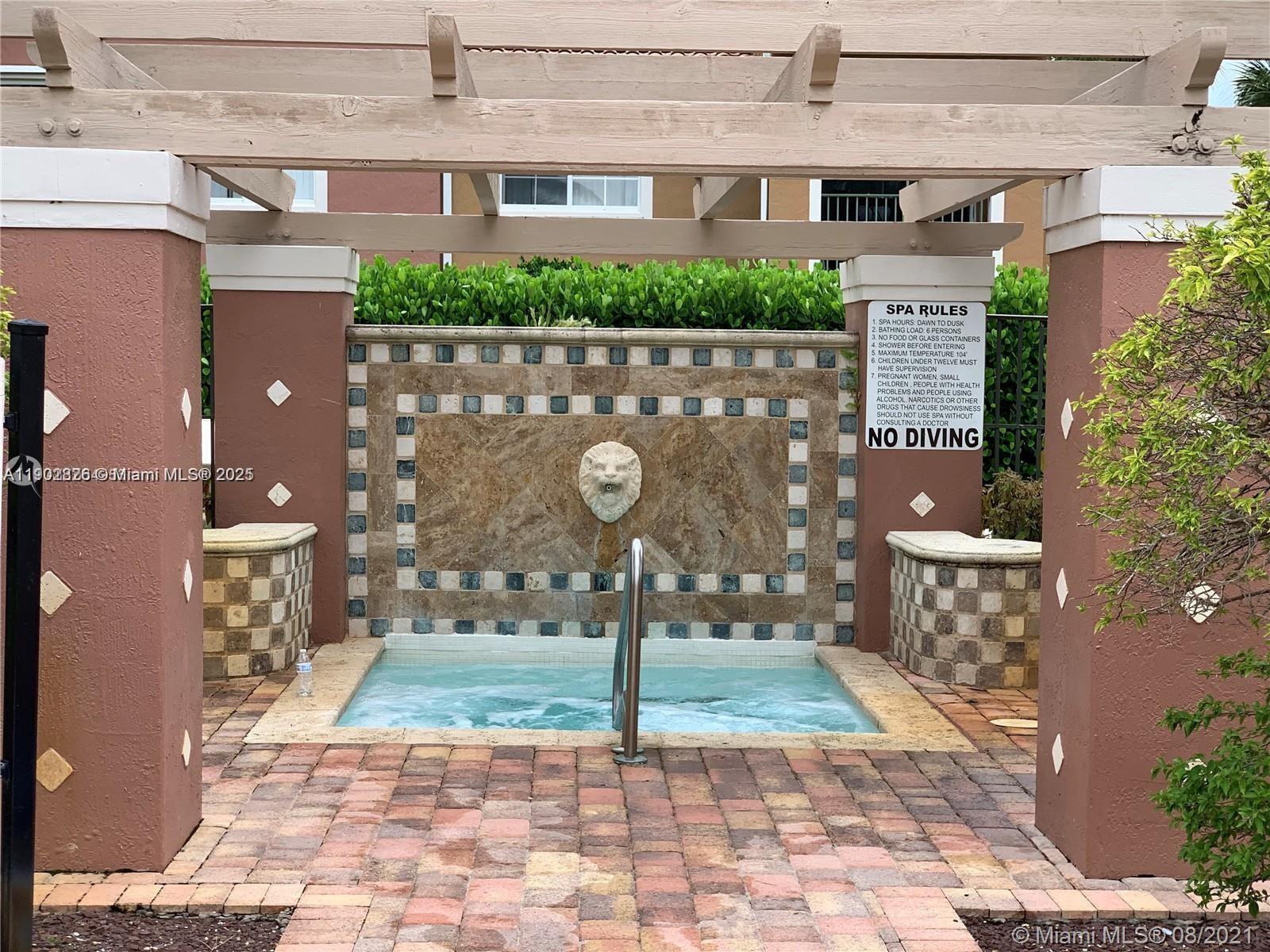 7816 Sonoma Springs Circle, Unit 104 Lake Worth, FL 33463 - Photo 11 of 12 a sign broad on the side of the building