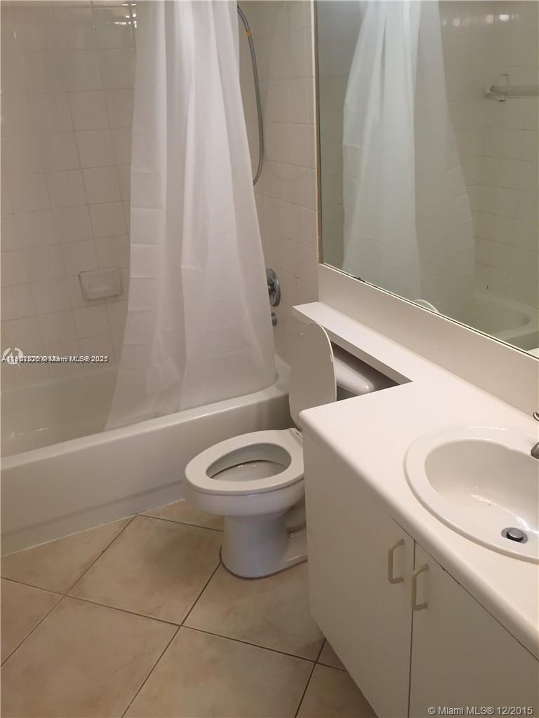 7816 Sonoma Springs Circle, Unit 104 Lake Worth, FL 33463 - Photo 3 of 12 a bathroom with a toilet sink and shower
