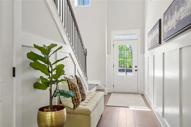 a living room with furniture a fireplace and a large window
