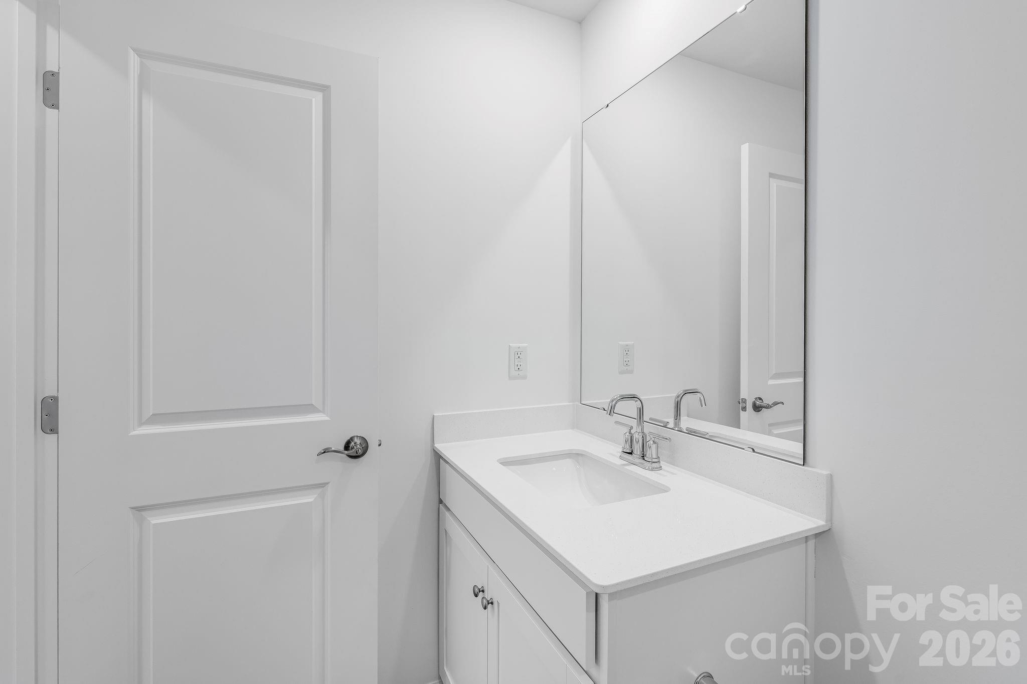 631 Sparano Loop York, SC 29745 - Photo 12 of 15 a bathroom with a sink and a mirror