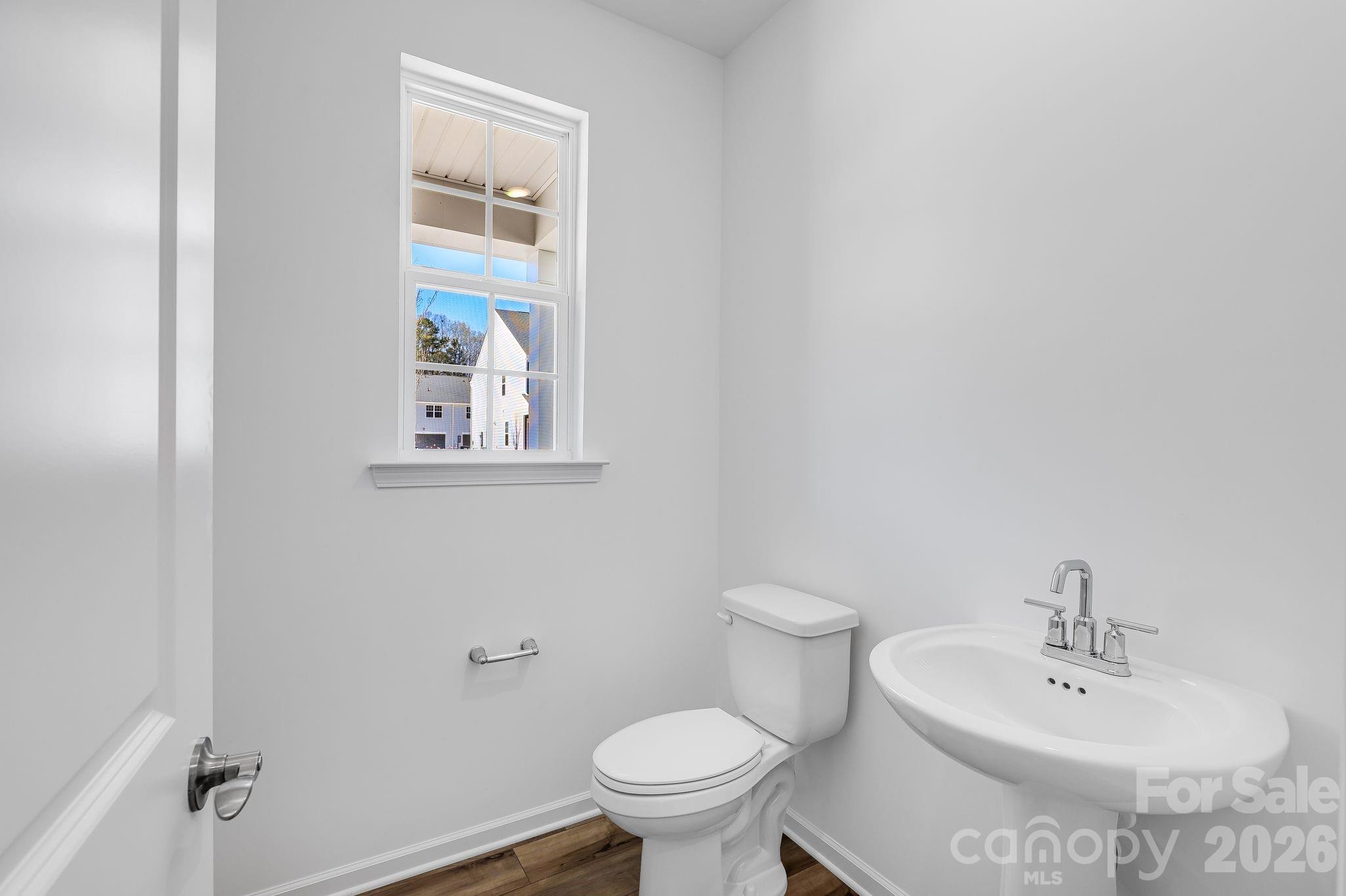 631 Sparano Loop York, SC 29745 - Photo 14 of 15 a bathroom with a sink and a toilet
