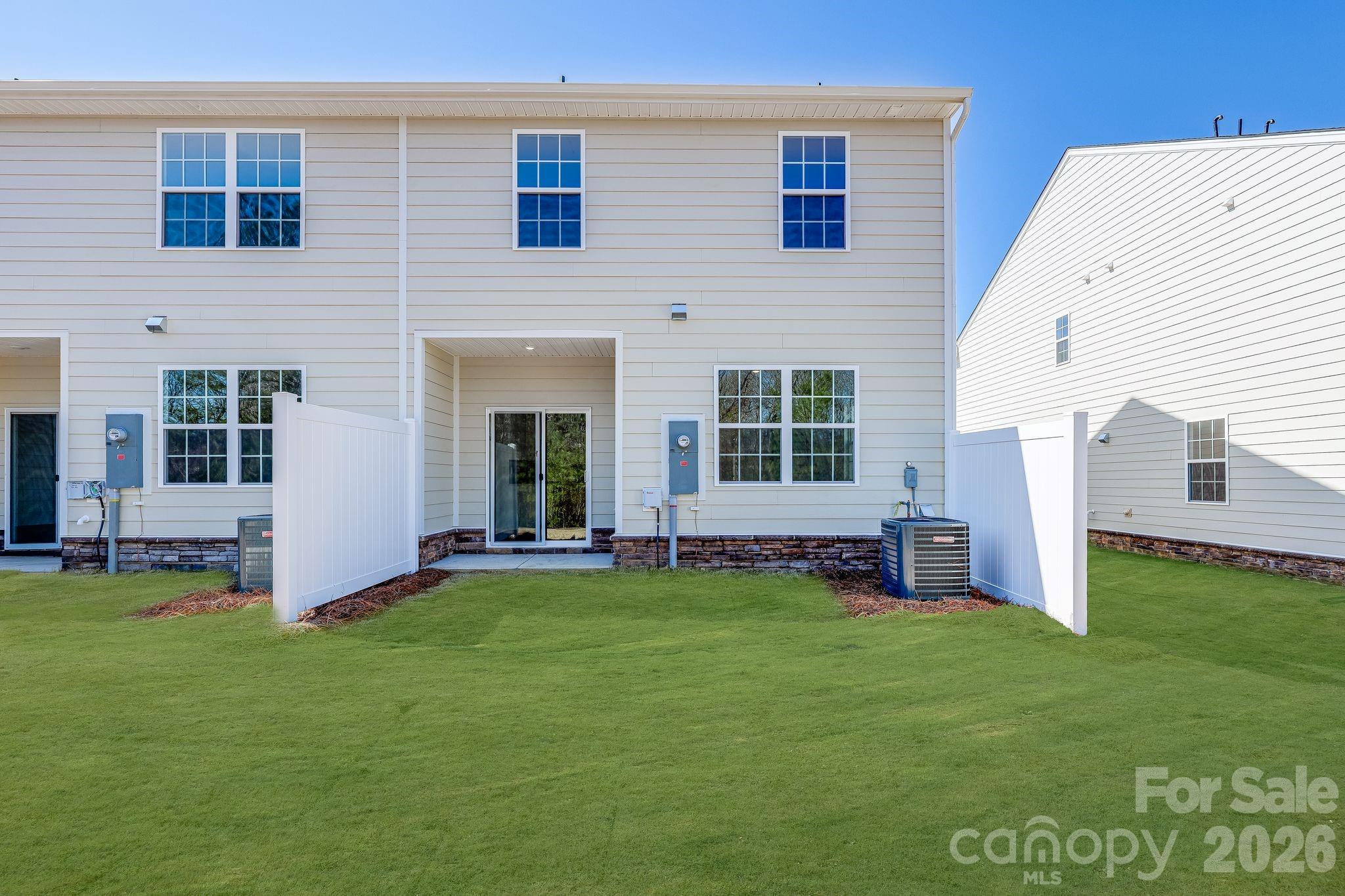 631 Sparano Loop York, SC 29745 - Photo 2 of 15 a view of an house with backyard space and a lake view