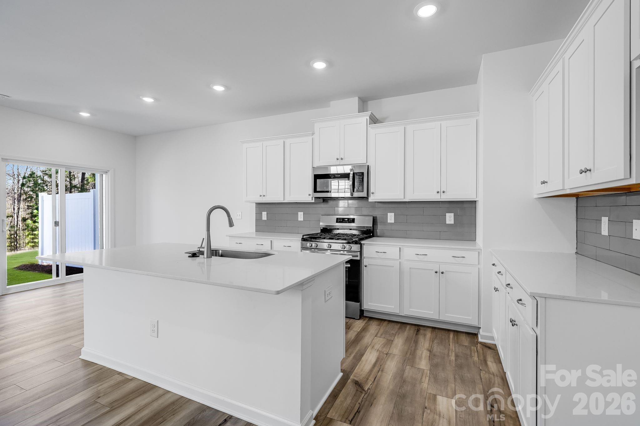 631 Sparano Loop York, SC 29745 - Photo 10 of 15 a kitchen with appliances a sink and cabinets