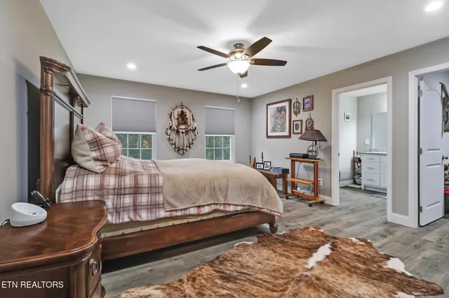 a bed room with a bed and a chandelier