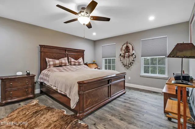 a bed room with a bed and a chandelier