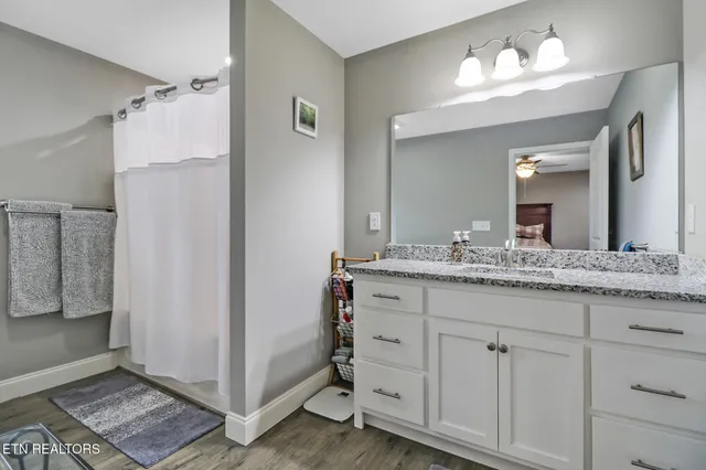 a bathroom with a double vanity sink and a mirror