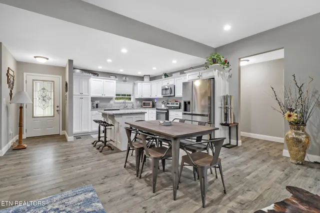 a kitchen with a table and chairs in it