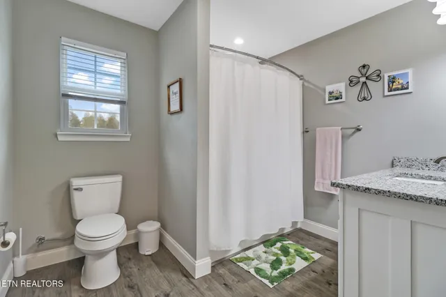 a bathroom with a toilet and a sink