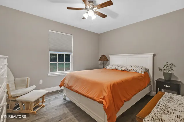 a bedroom with a bed and window