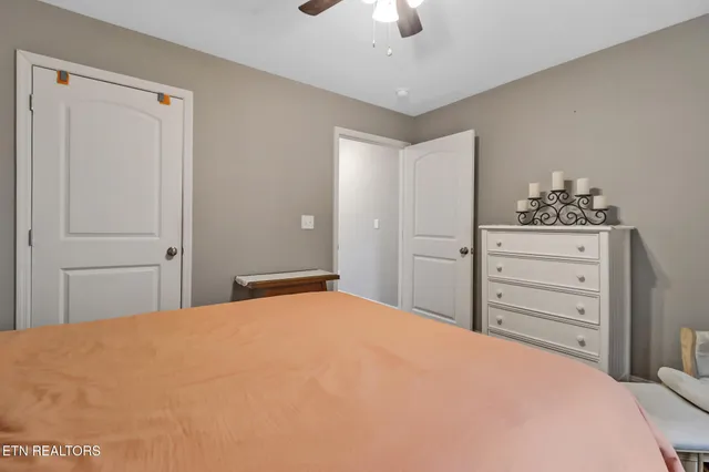 a bedroom with a bed and a dresser