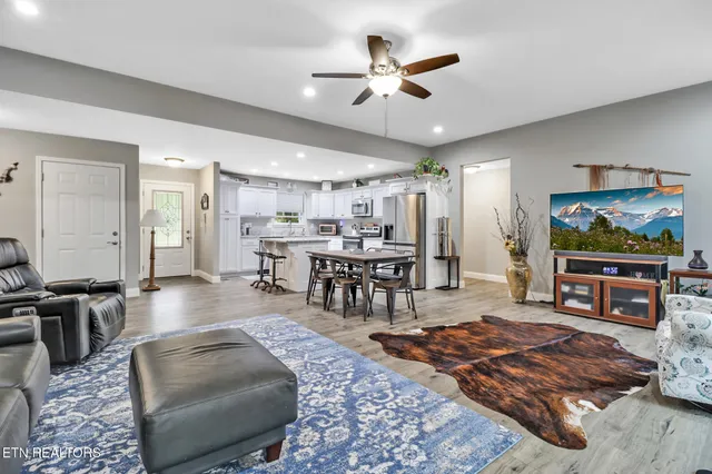 a living room with furniture and a flat screen tv
