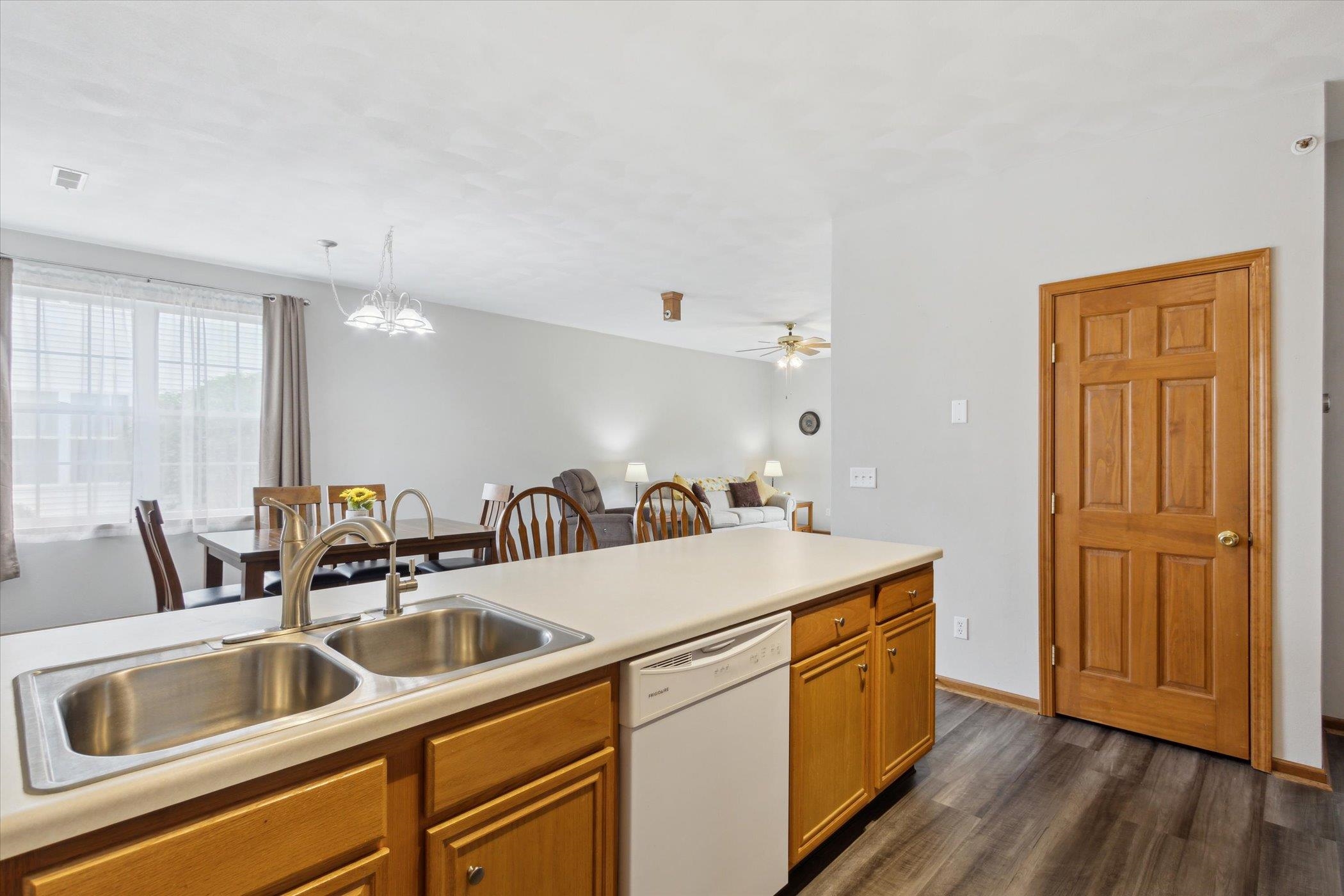 10156 Metalmark Lane, Unit 2 Roscoe, IL 61073 - Photo 18 of 38 a kitchen with a sink and a refrigerator