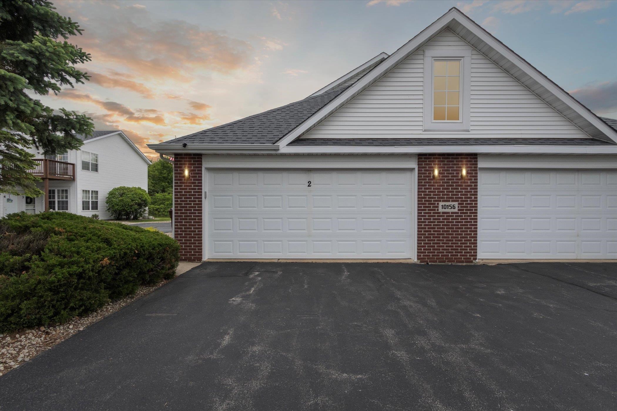 10156 Metalmark Lane, Unit 2 Roscoe, IL 61073 - Photo 2 of 38 a front view of house with garage