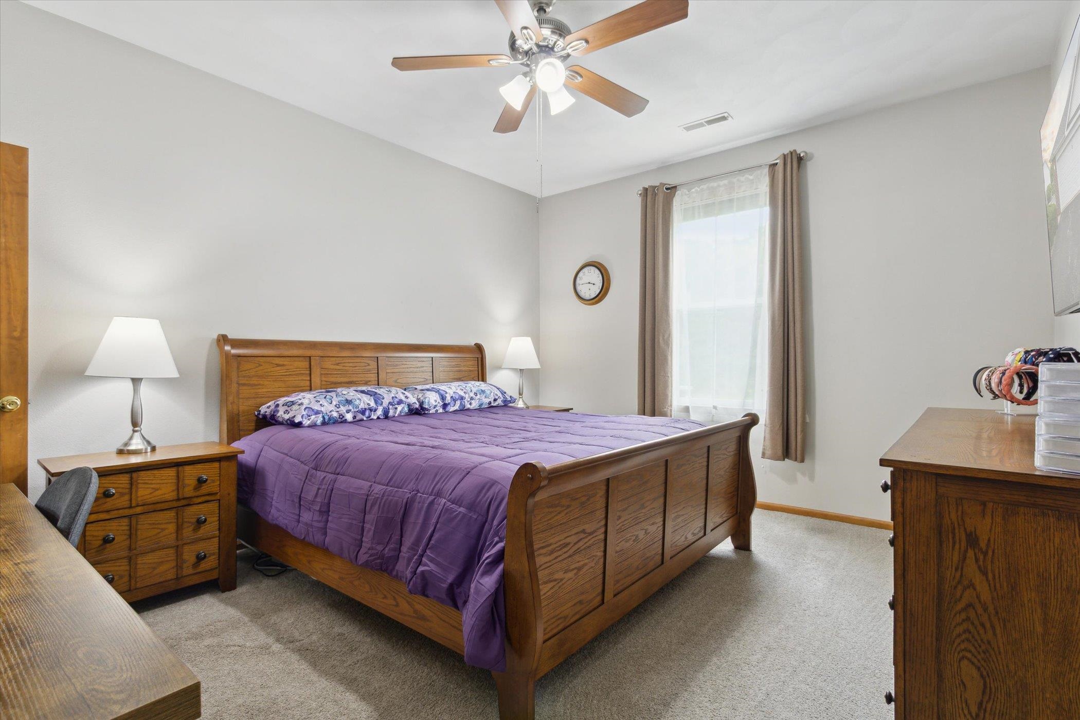 10156 Metalmark Lane, Unit 2 Roscoe, IL 61073 - Photo 25 of 38 a bedroom with a bed and window