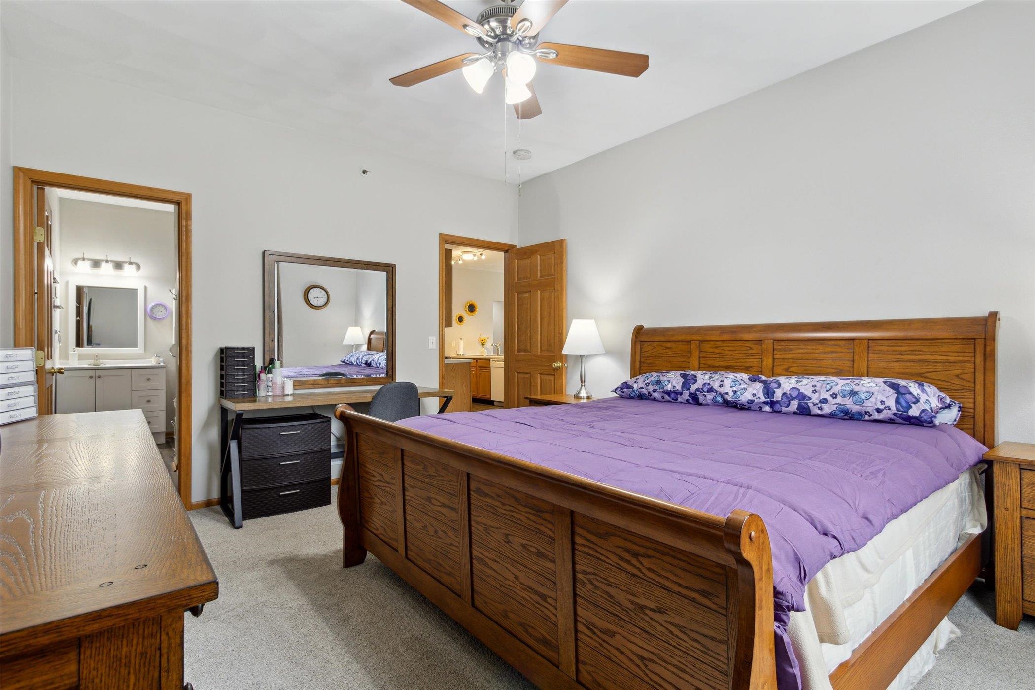 10156 Metalmark Lane, Unit 2 Roscoe, IL 61073 - Photo 26 of 38 a bedroom with a bed and a dresser