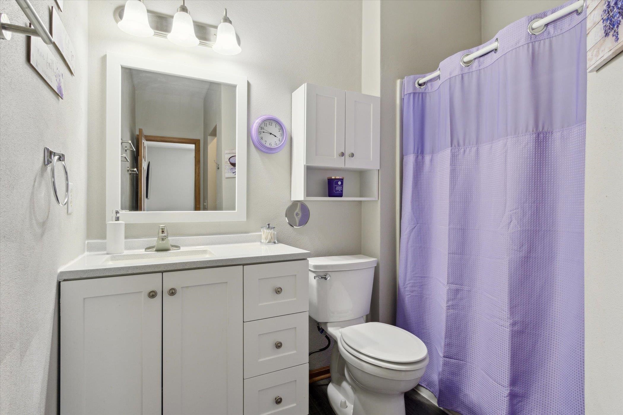 10156 Metalmark Lane, Unit 2 Roscoe, IL 61073 - Photo 28 of 38 a bathroom with a granite countertop toilet sink and mirror