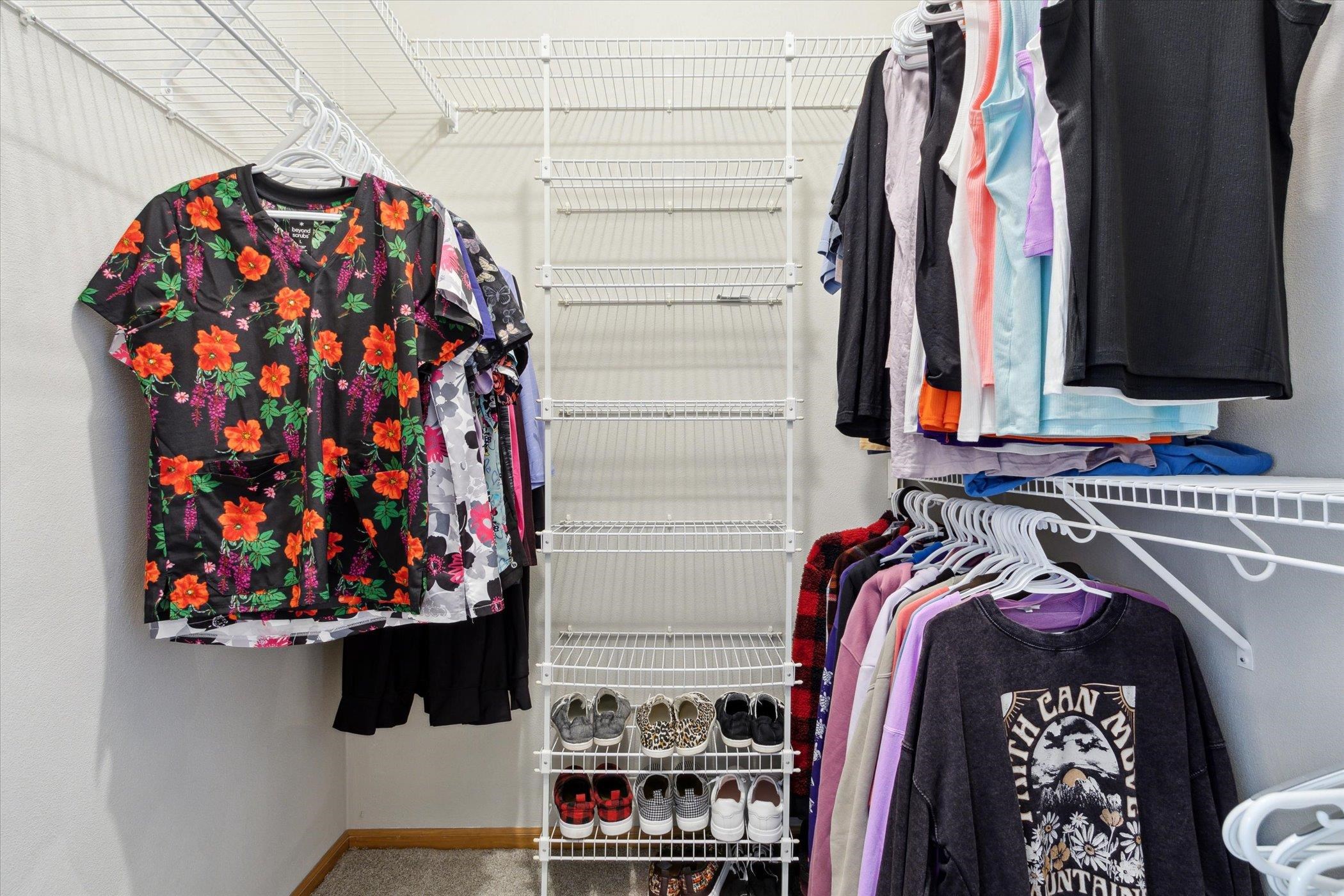 10156 Metalmark Lane, Unit 2 Roscoe, IL 61073 - Photo 29 of 38 a view of walk in closet with clothes and shoes