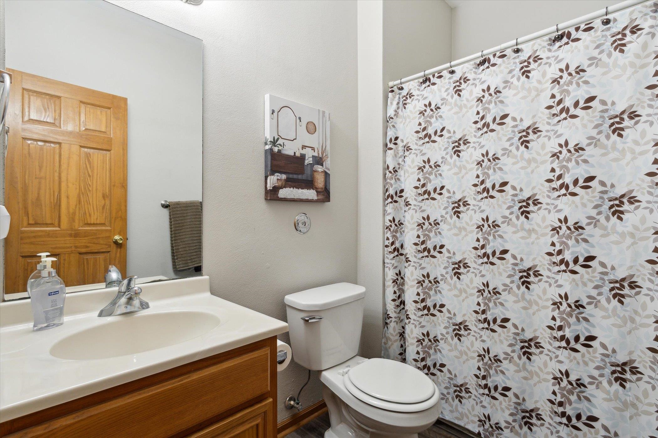 10156 Metalmark Lane, Unit 2 Roscoe, IL 61073 - Photo 31 of 38 a bathroom with a sink toilet and a mirror