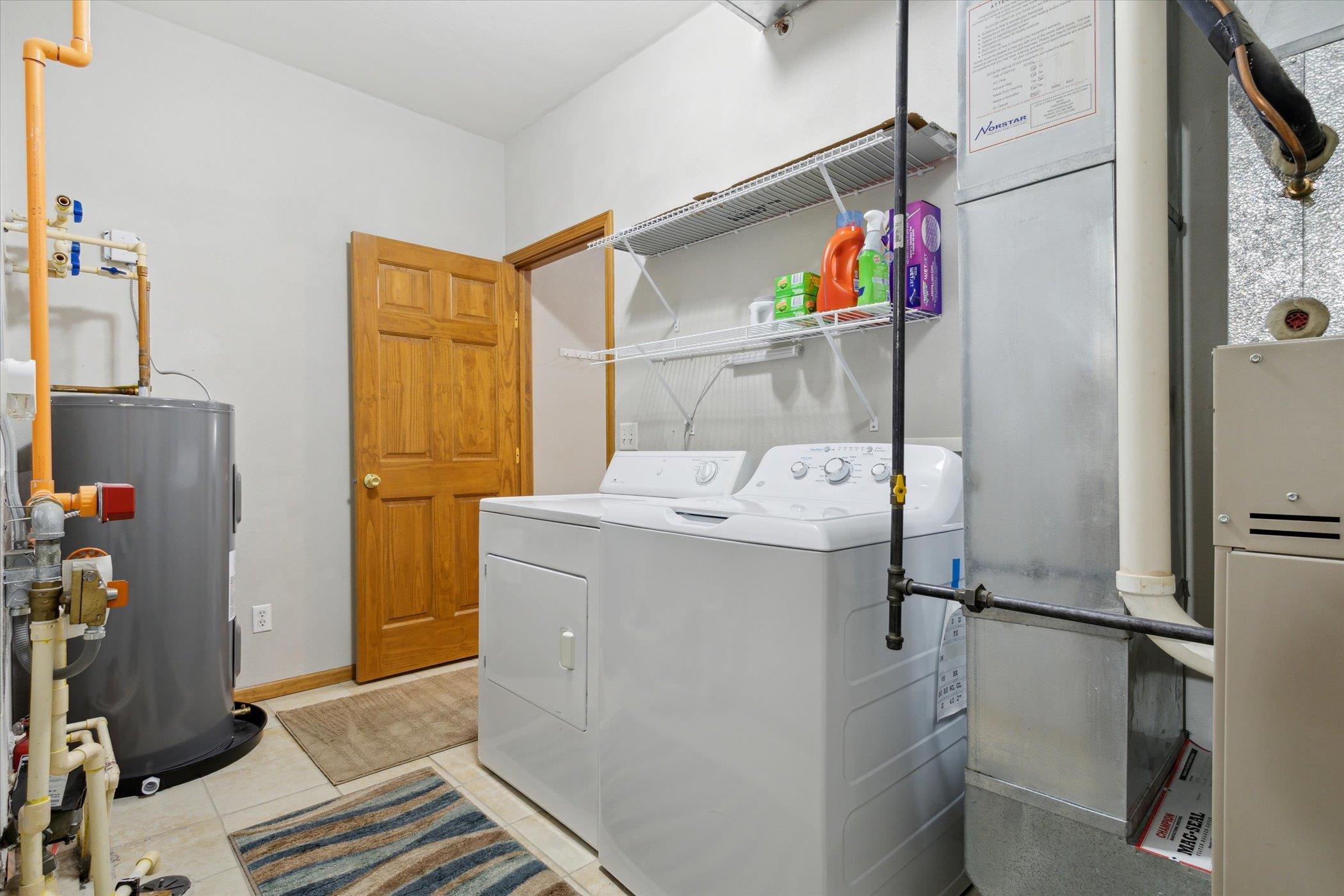 10156 Metalmark Lane, Unit 2 Roscoe, IL 61073 - Photo 33 of 38 a utility room with dryer and washer