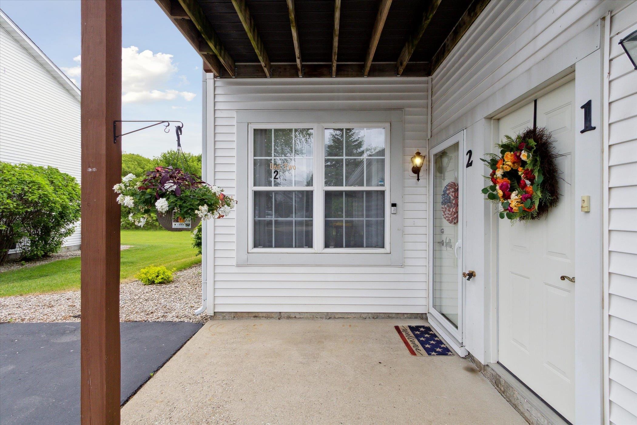 10156 Metalmark Lane, Unit 2 Roscoe, IL 61073 - Photo 5 of 38 a view of a door of the house with a porch