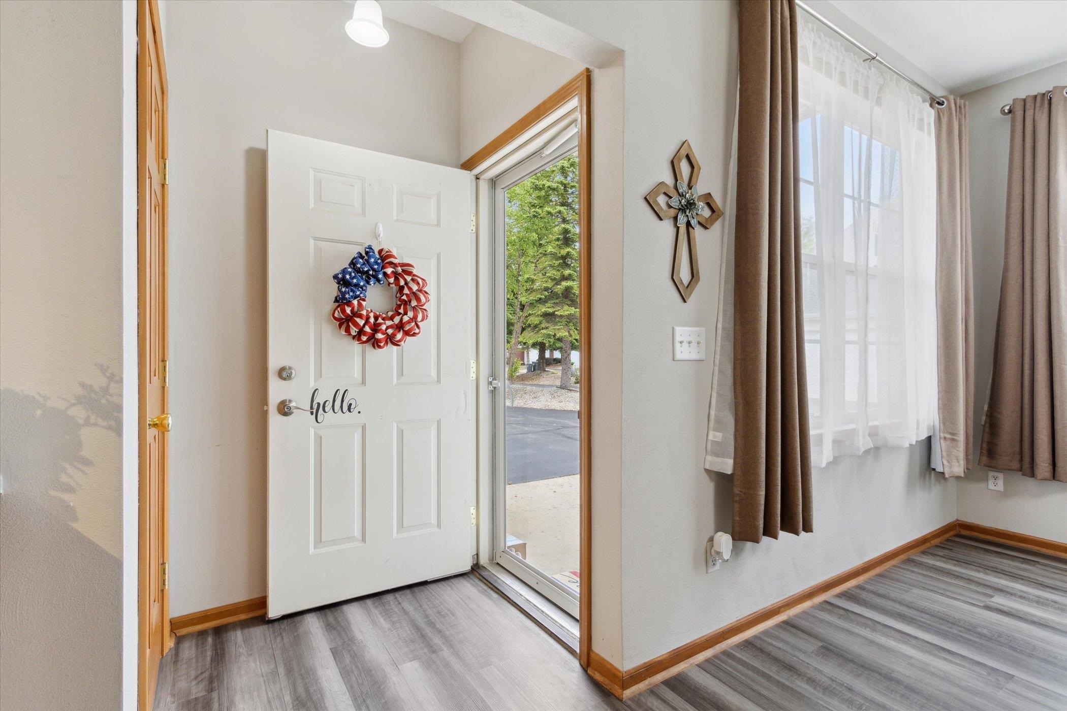 10156 Metalmark Lane, Unit 2 Roscoe, IL 61073 - Photo 6 of 38 a view of a hallway with wooden floor and entryway