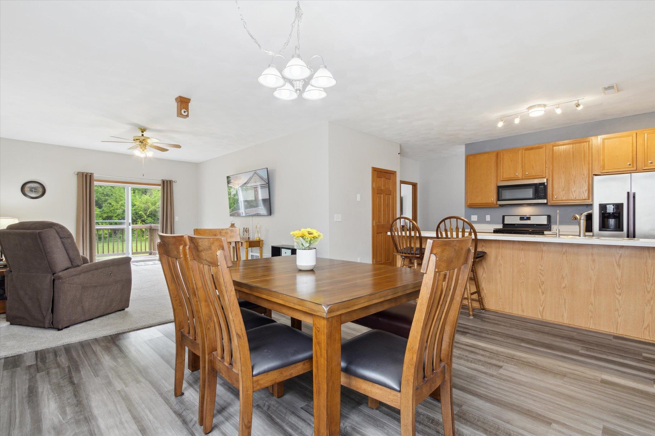 10156 Metalmark Lane, Unit 2 Roscoe, IL 61073 - Photo 9 of 38 a view of a dining room with furniture window and wooden floor