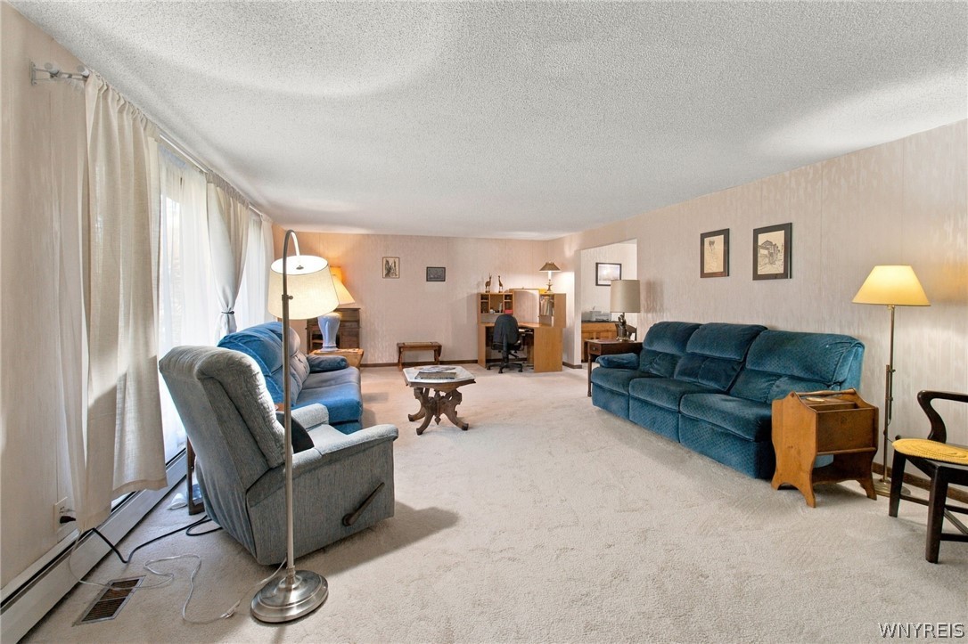 123 Ranch Trail West Amherst, NY 14221 - Photo 37 of 38 An open floorplan living area with comfortable wall-to-wall carpeting