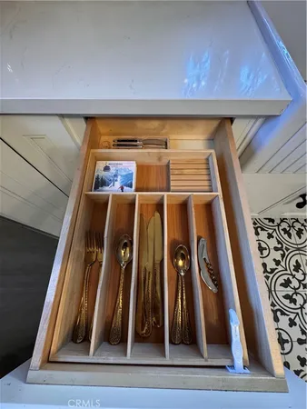 a kitchen with a refrigerator and a stove