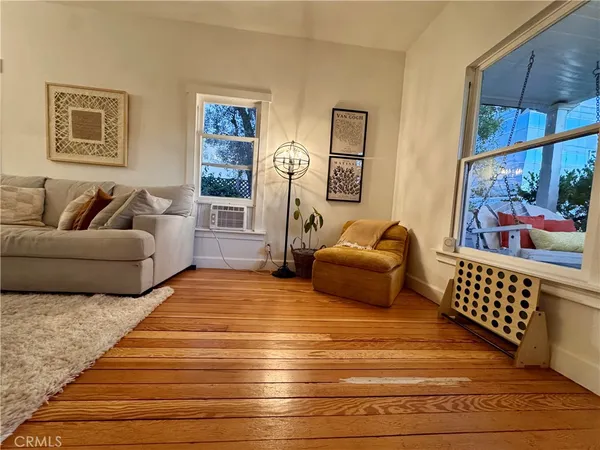 a bedroom with furniture and a rug