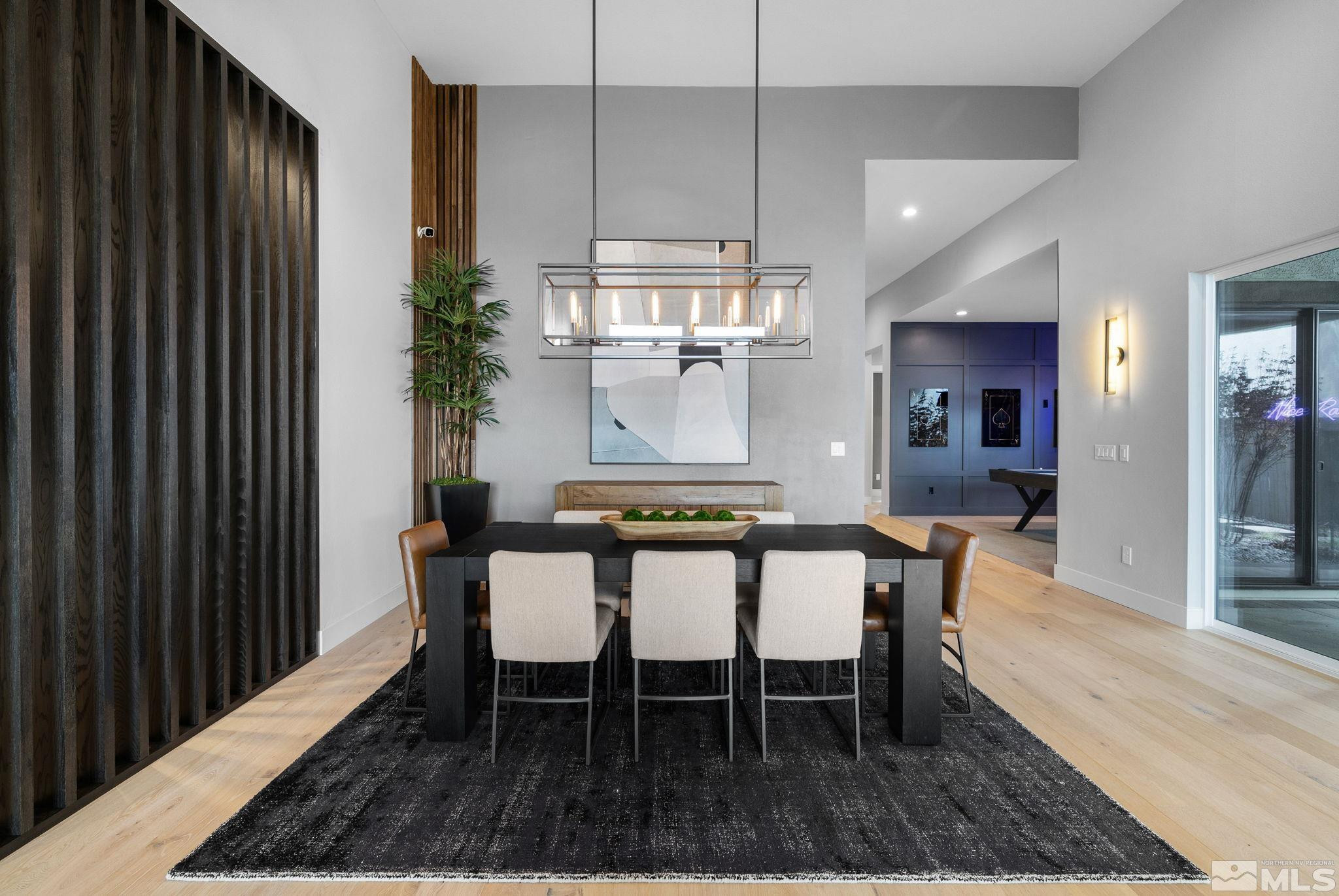2913 Ruby Desert Drive Reno, NV 89521 - Photo 11 of 39 a dining room with chandelier and wooden floor