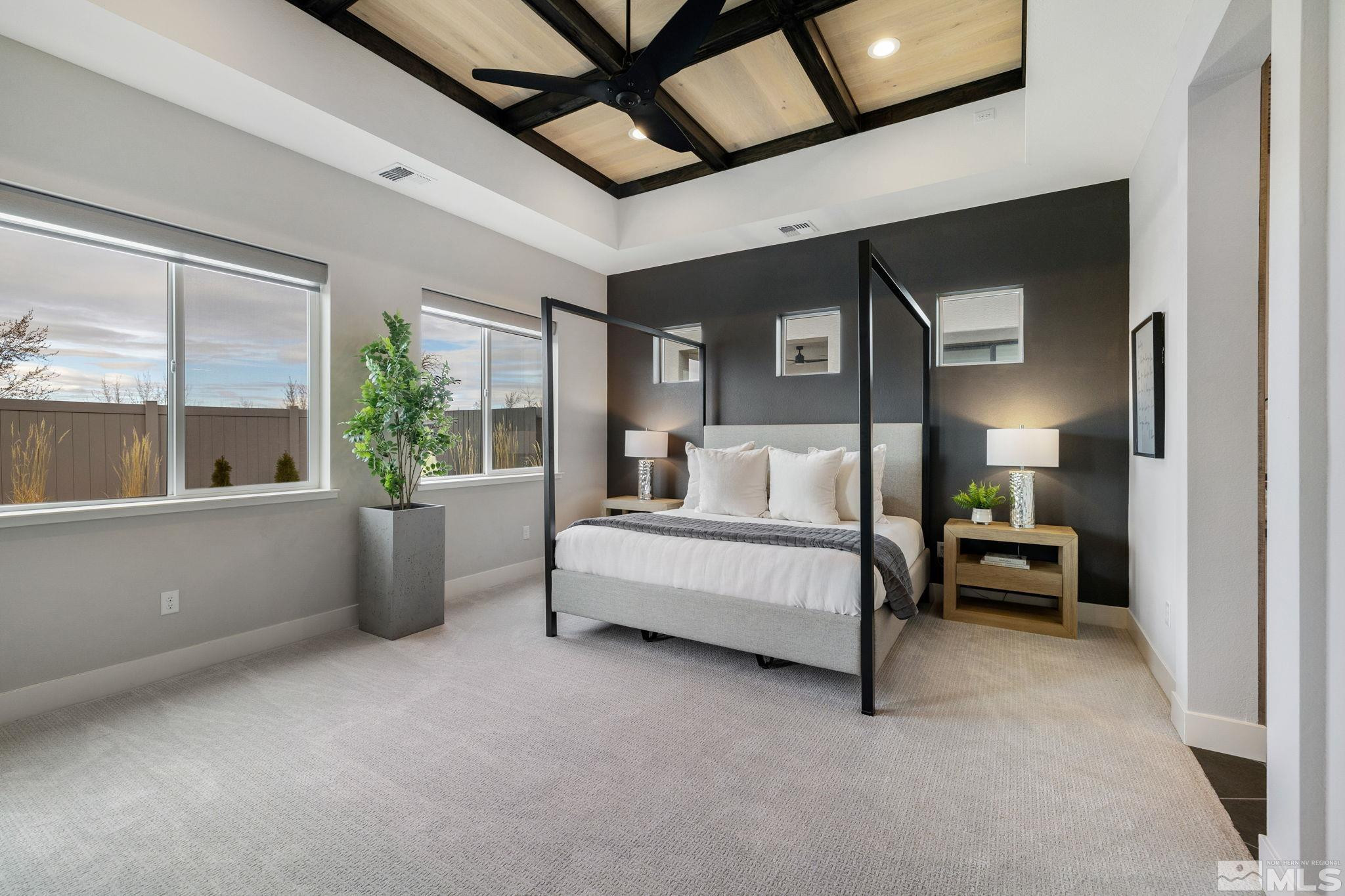 2913 Ruby Desert Drive Reno, NV 89521 - Photo 18 of 39 a spacious bedroom with a bed and a large window