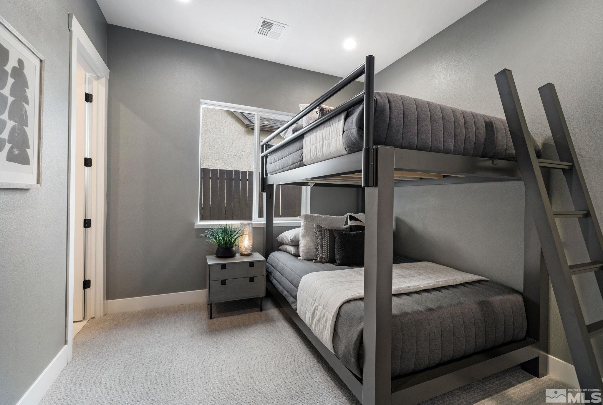 2913 Ruby Desert Drive Reno, NV 89521 - Photo 28 of 39 a bedroom with a bed and wooden floor