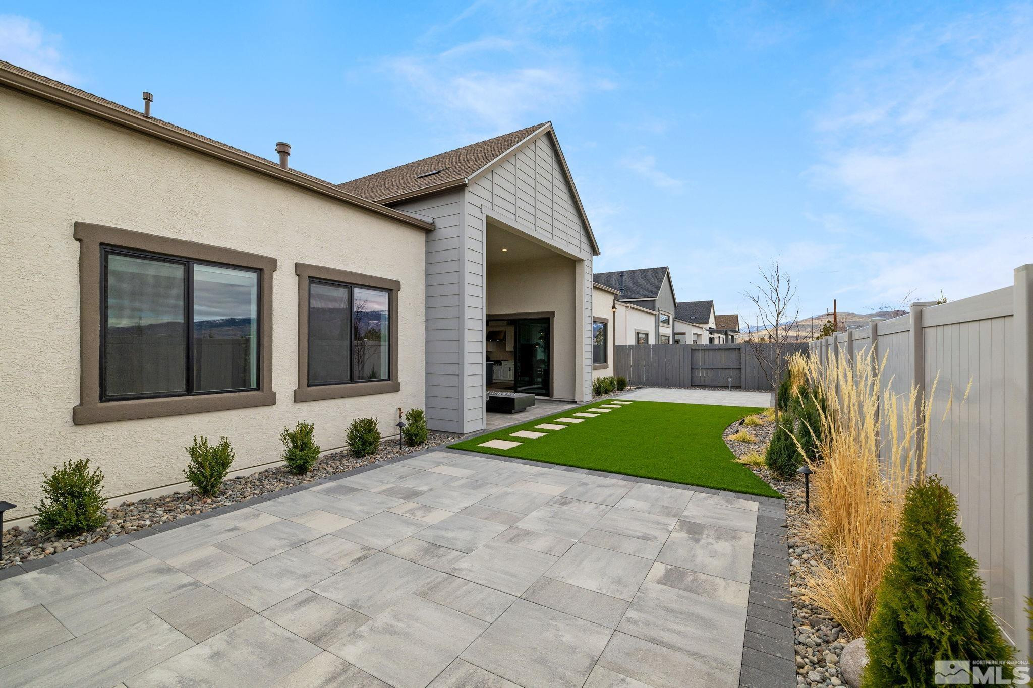 2913 Ruby Desert Drive Reno, NV 89521 - Photo 35 of 39 a front view of a house with a yard and garage