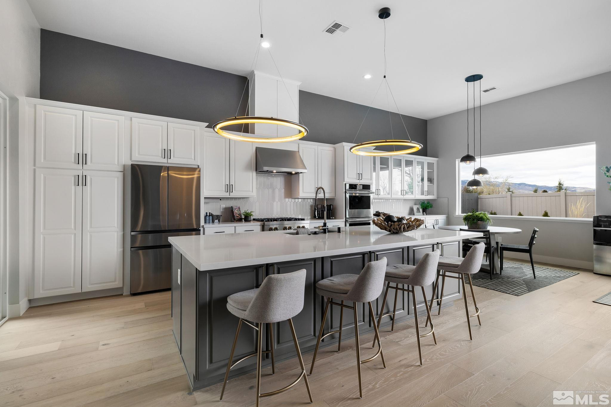 2913 Ruby Desert Drive Reno, NV 89521 - Photo 5 of 39 a large kitchen with a table and chairs