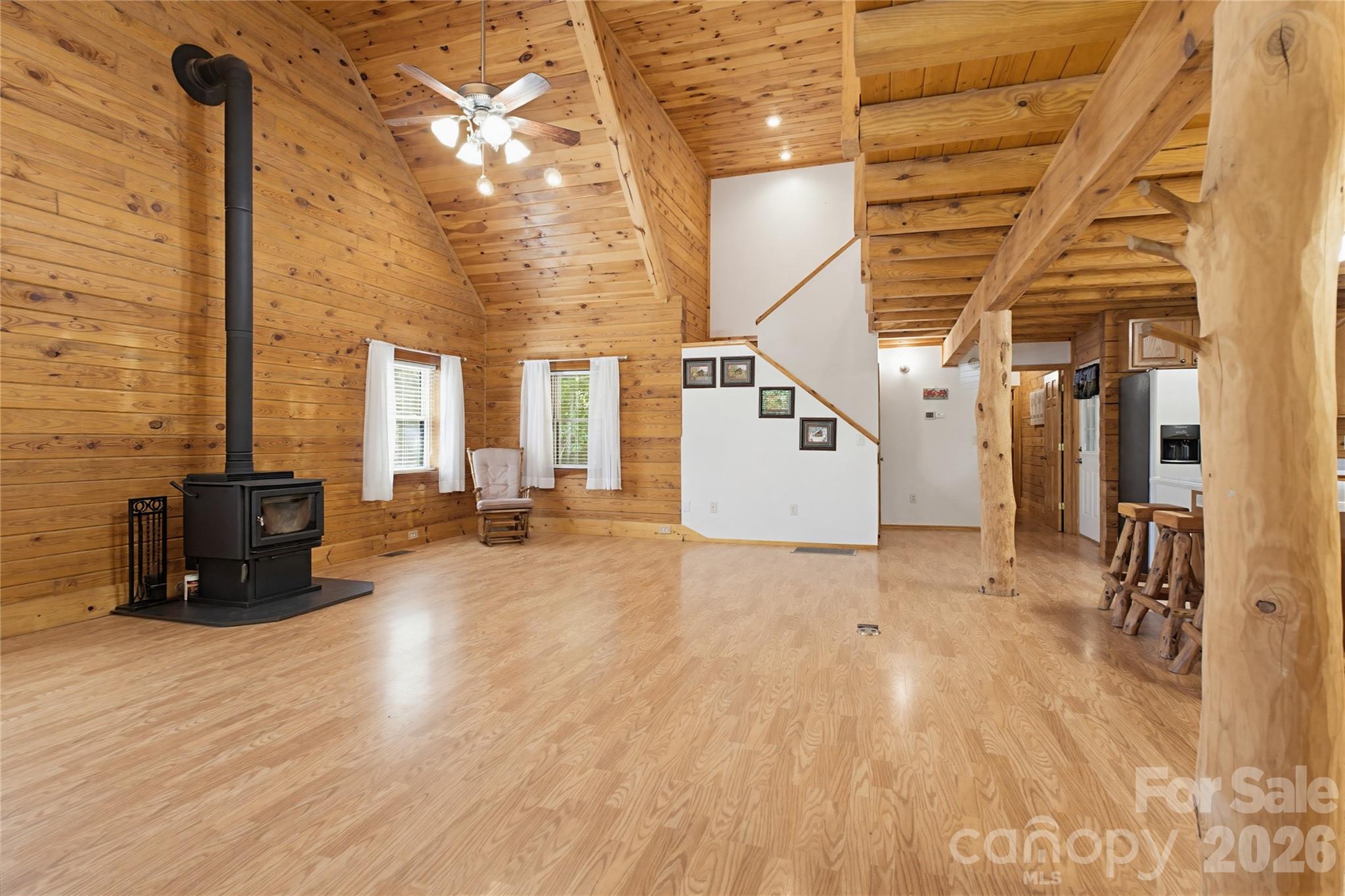 451 Rustic Ridge Drive Canton, NC 28716 - Photo 5 of 44 a view of empty room with wooden floor and windows