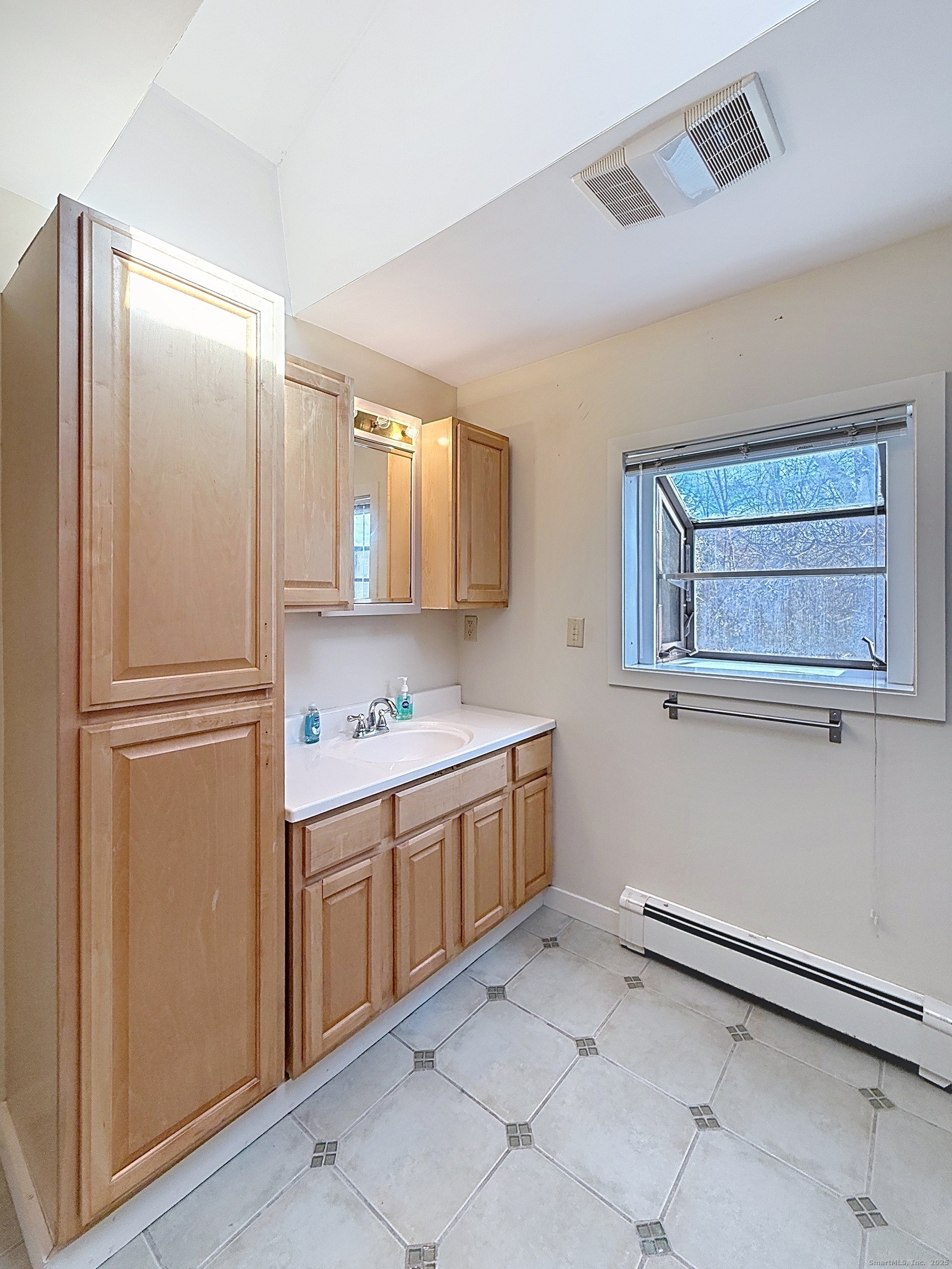198 Forest Road Coventry, CT 06238 - Photo 13 of 24 a kitchen with a refrigerator and white cabinets