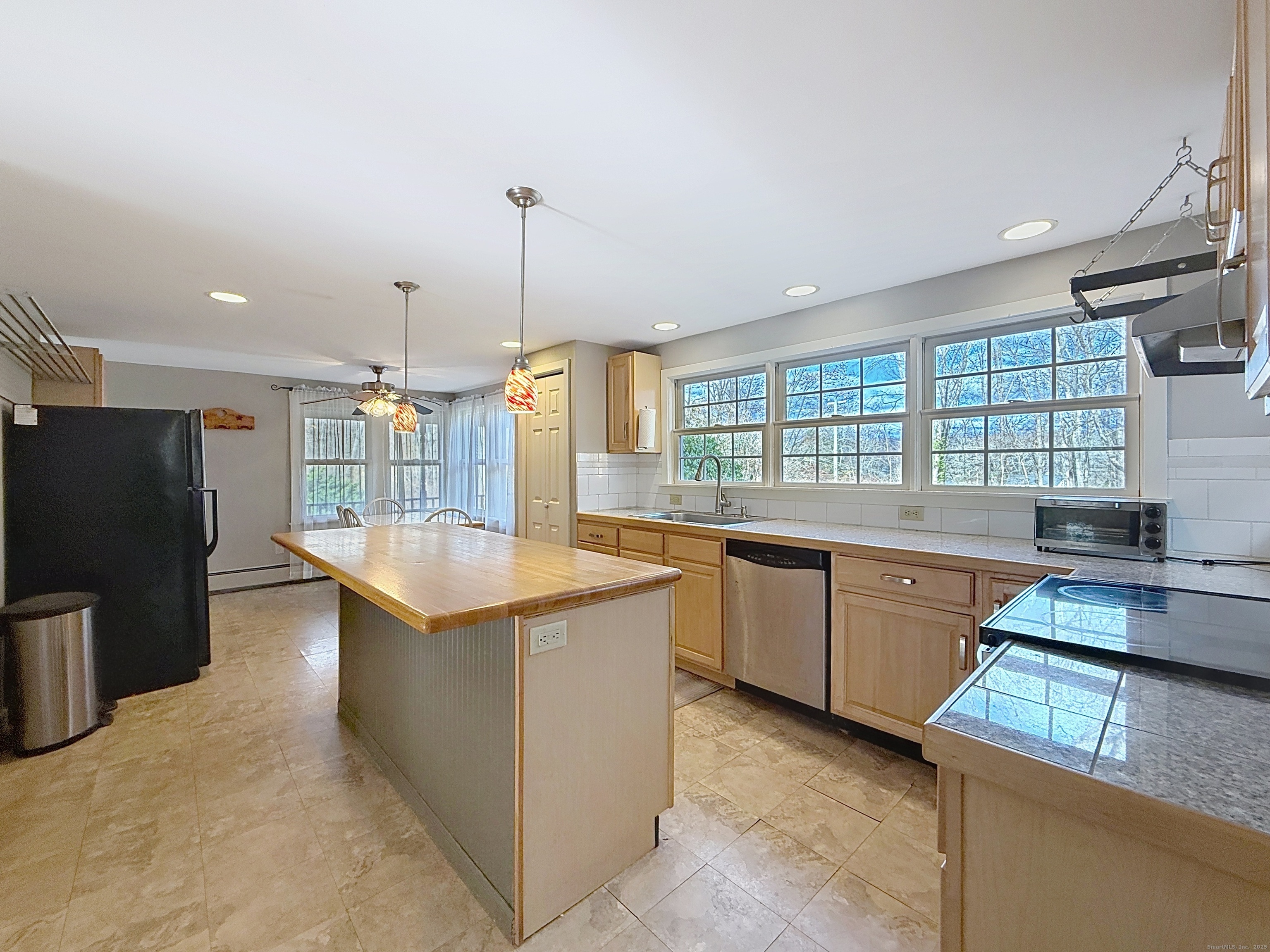 198 Forest Road Coventry, CT 06238 - Photo 4 of 24 a kitchen with stainless steel appliances granite countertop a sink a stove and a refrigerator