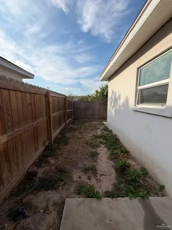 a backyard of a house with lots of green space