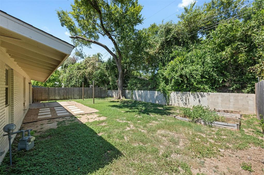 4610 South 1st Street Austin, TX 78745 - Photo 21 of 23 a view of backyard with wooden fence and a large tree