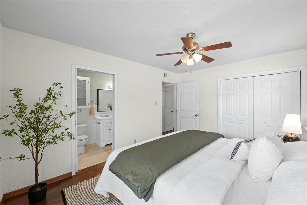 4610 South 1st Street Austin, TX 78745 - Photo 8 of 23 a bedroom with a bed and a potted plant