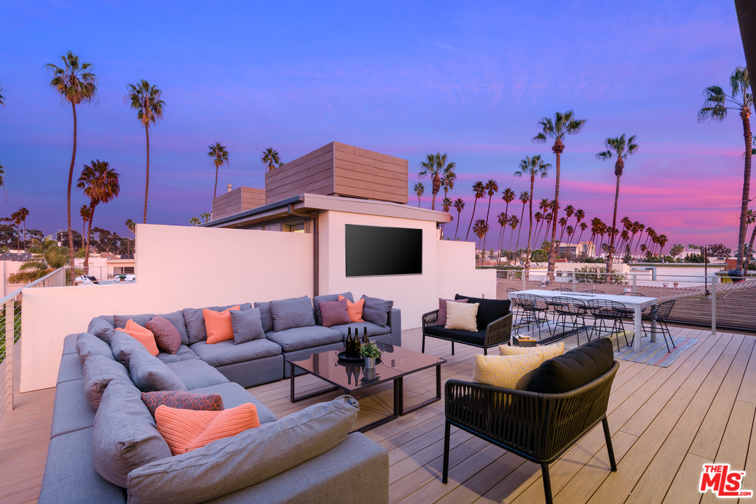 a terrace of a house with outdoor seating